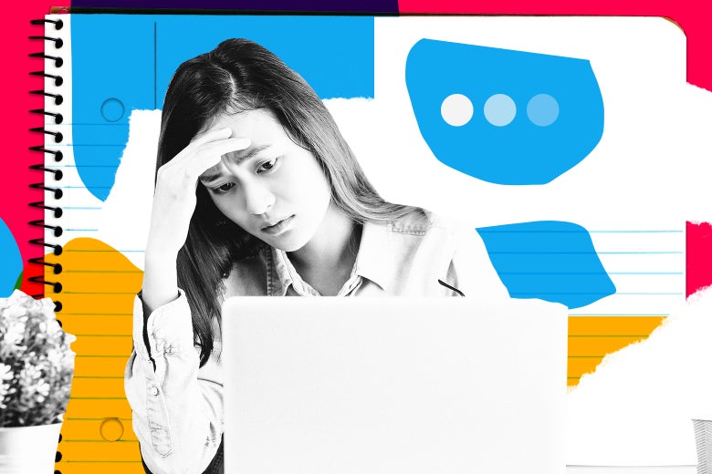 Woman looking stressed at a computer screen.